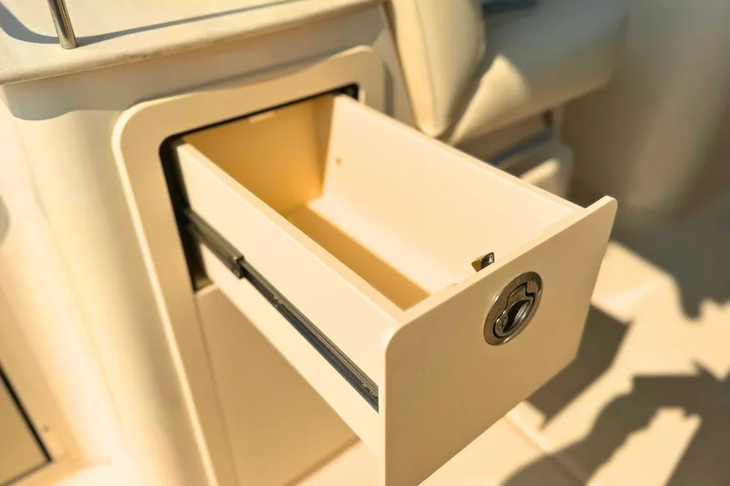 Slide: The Image of Open storage drawer on 2023 Grady-White Freedom 285 boat, showcasing interior design. - 27
