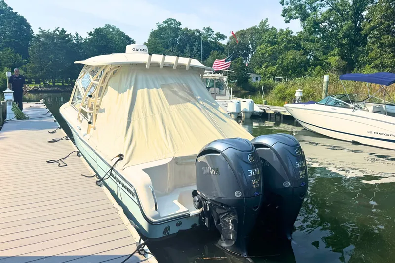 Slide: The Image of 2023 Grady-White Freedom 285 boat docked with twin Yamaha engines. - 9
