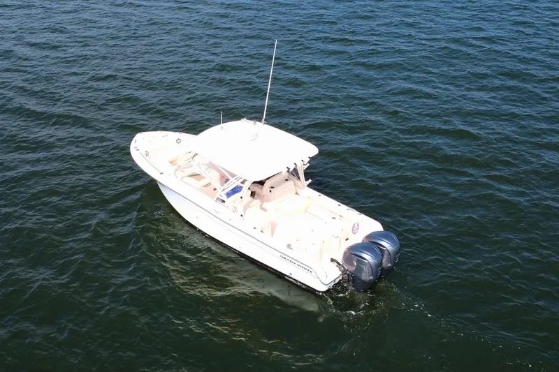 Slide: The Image of 2023 Grady-White Freedom 285 boat cruising on open water. - 4
