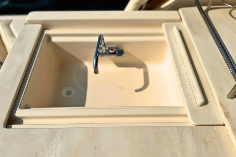 Slide: The Image of Sink on 2023 Grady-White Freedom 285 boat, featuring a sleek faucet design. - 22