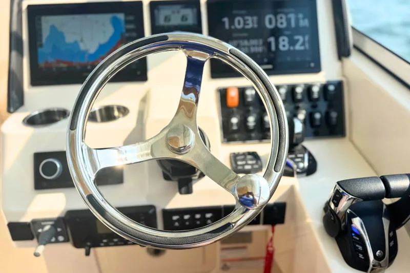 Slide: The Image of 2023 Grady-White Freedom 285 helm with modern controls and navigation displays. - 39