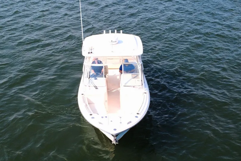 Slide: The Image of 2023 Grady-White Freedom 285 boat cruising on open water. - 6
