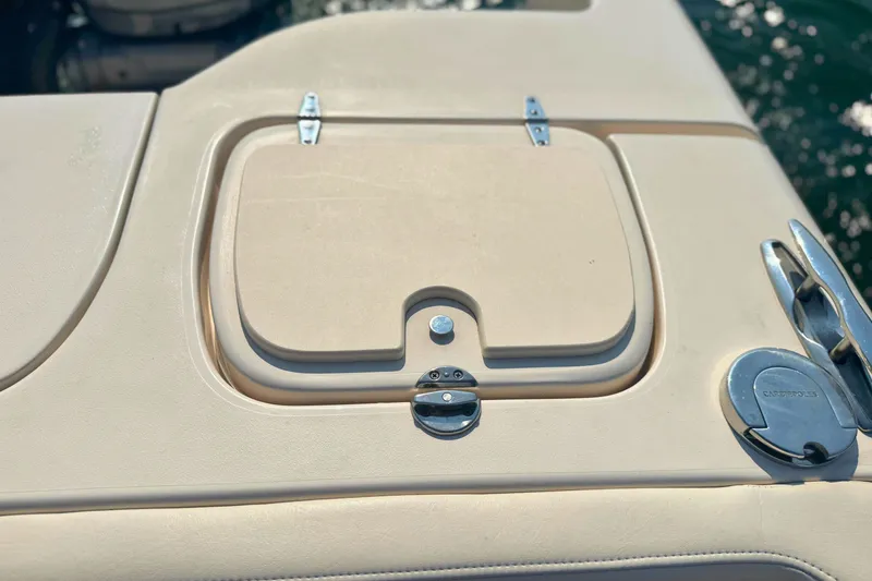 Slide: The Image of 2023 Grady-White Freedom 285 boat deck with hatch and cleat in sunlight. - 14