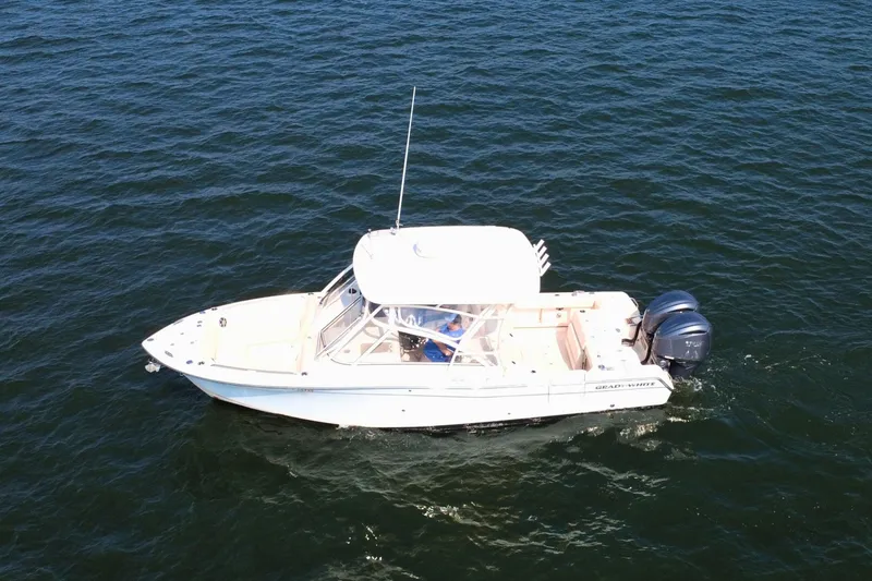 Slide: The Image of 2023 Grady-White Freedom 285 boat cruising on open water. - 1