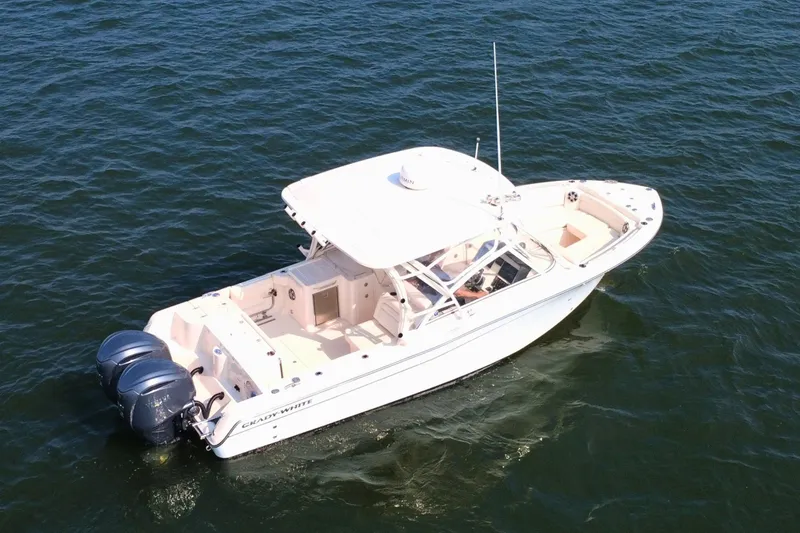 Slide: The Image of 2023 Grady-White Freedom 285 boat cruising on open water. - 5
