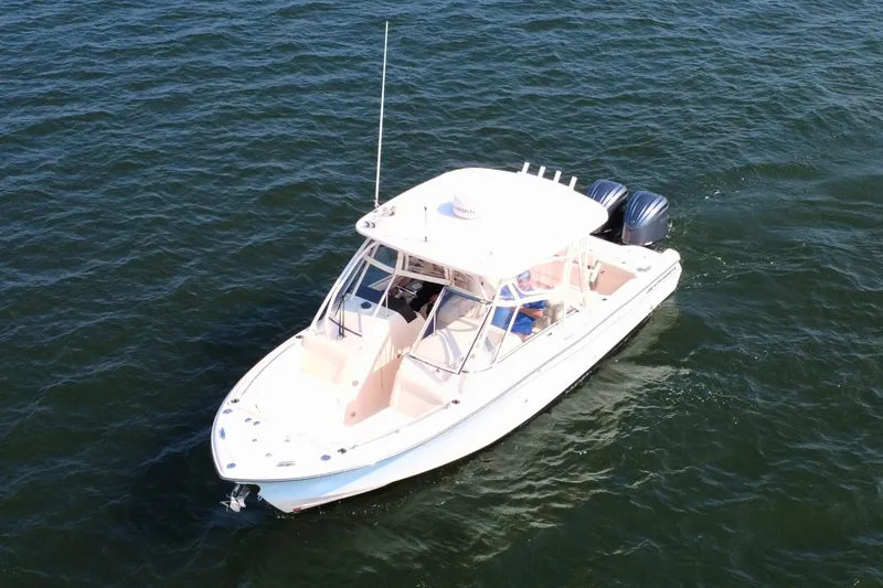 Slide: The Image of 2023 Grady-White Freedom 285 boat cruising on open water. - 2