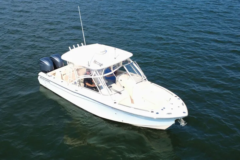 The Image of 2023 Grady-White Freedom 285 boat cruising on open water. - 0