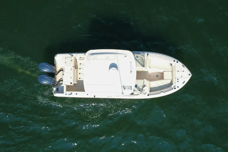 Slide: The Image of Aerial view of 2023 Grady-White Freedom 285 boat cruising on water. - 8