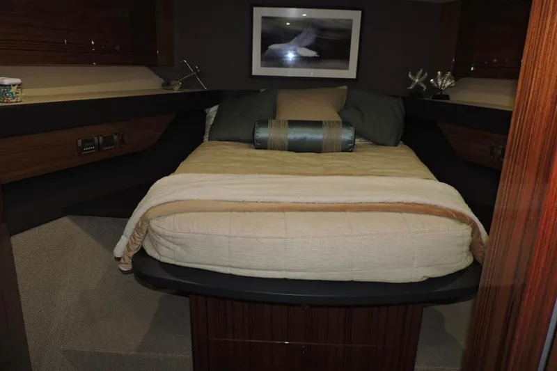 Slide: The Image of Luxurious cabin interior of 2016 Maritimo M51 yacht with cozy bedding and elegant decor. - 29