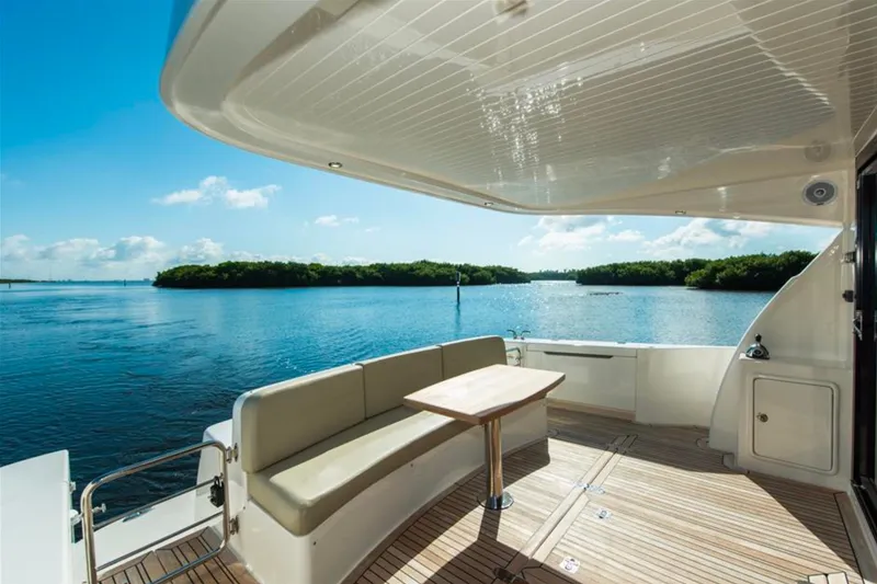 Slide: The Image of Luxury 2016 Maritimo M51 yacht deck with scenic water view. - 17