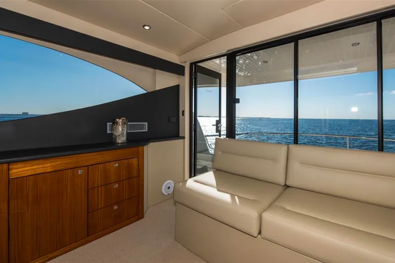 Slide: The Image of Luxurious interior of 2016 Maritimo M51 yacht with ocean view through large windows. - 12