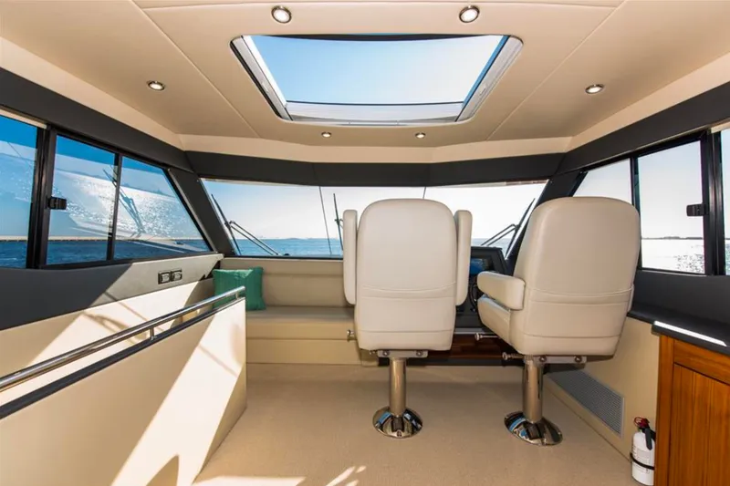 Slide: The Image of Interior of 2016 Maritimo M51 yacht with panoramic windows and plush seating. - 9