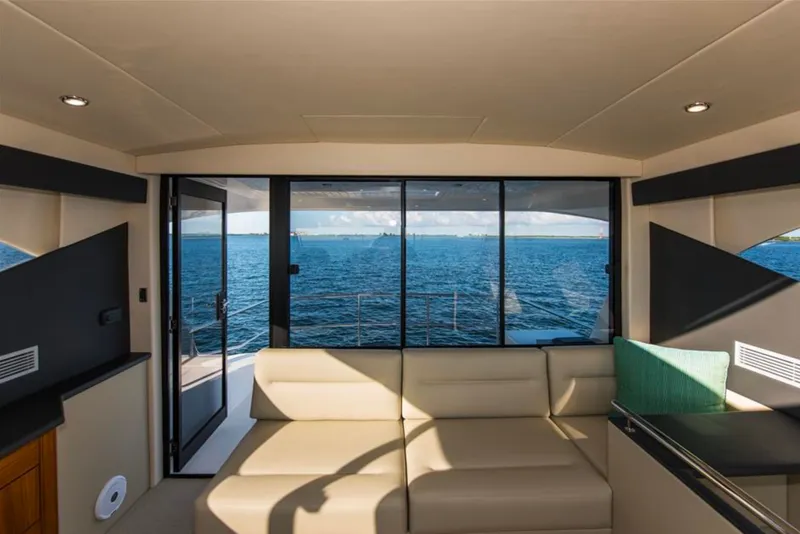 Slide: The Image of Interior view of 2016 Maritimo M51 yacht with ocean backdrop through large windows. - 11