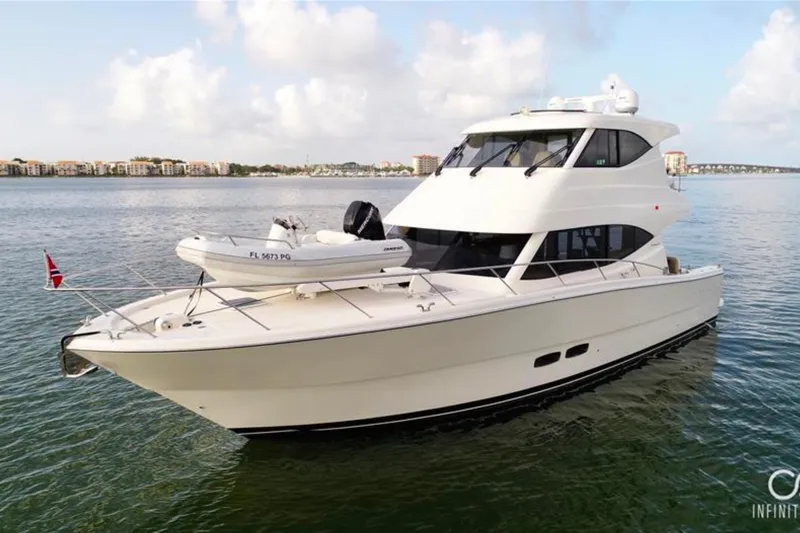Slide: The Image of 2016 Maritimo M51 yacht on calm water, featuring sleek design and modern amenities. - 1