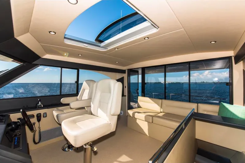 Slide: The Image of Luxurious interior of 2016 Maritimo M51 yacht with ocean view and plush seating. - 7