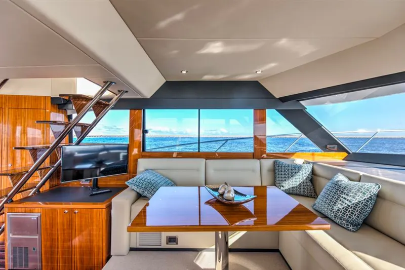 Slide: The Image of Luxurious interior of 2016 Maritimo M51 yacht with ocean view, featuring elegant seating and decor. - 24