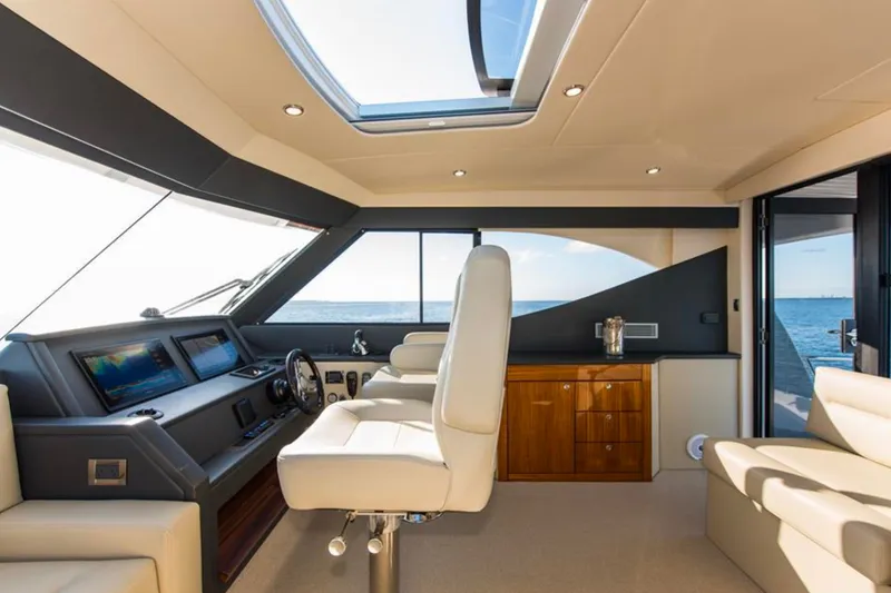 Slide: The Image of Luxurious interior of 2016 Maritimo M51 yacht with modern helm and ocean view. - 8