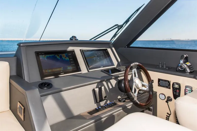 Slide: The Image of Helm of 2016 Maritimo M51 yacht with navigation screens and steering wheel. - 6
