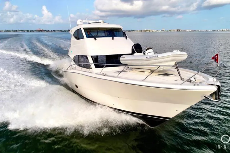 The Image of 2016 Maritimo M51 yacht cruising on open water under a clear sky. - 0