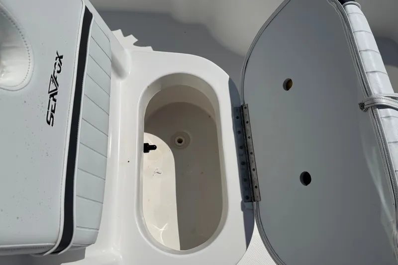Slide: The Image of Open storage compartment on a 2012 Sea Fox 200XT boat. - 22