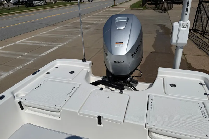 Slide: The Image of 2012 Sea Fox 200XT boat with Honda 150 engine, docked on a sunny day. - 24