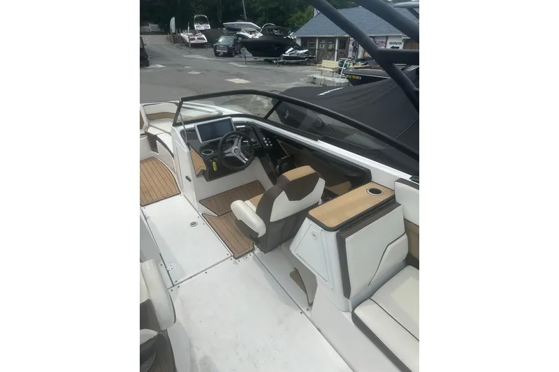 Slide: The Image of 2023 Yamaha Boats 252S cockpit with modern dashboard and seating, showcasing luxury design. - 26
