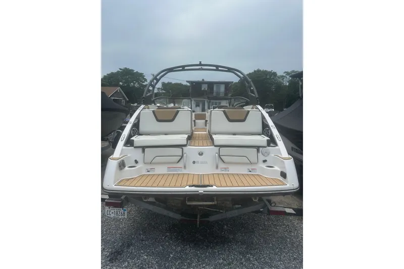 Slide: The Image of 2023 Yamaha Boats 252S, rear view, showcasing sleek design and spacious seating. - 9