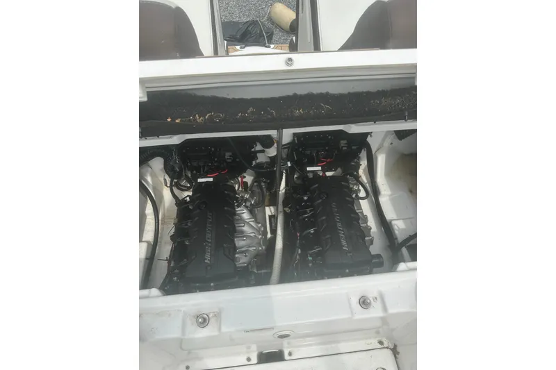 Slide: The Image of 2023 Yamaha Boats 252S engine compartment with twin engines visible. - 37