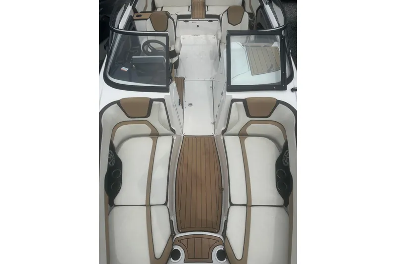 Slide: The Image of 2023 Yamaha Boats 252S interior with sleek seating and wood-style flooring. - 22