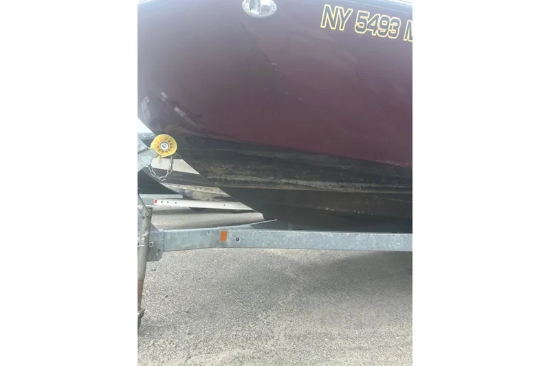 Slide: The Image of 2023 Yamaha Boats 252S on trailer, showing hull and registration number. - 15