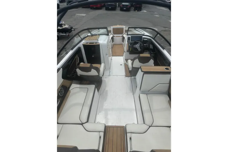 Slide: The Image of 2023 Yamaha Boats 252S interior with spacious seating and modern dashboard design. - 28