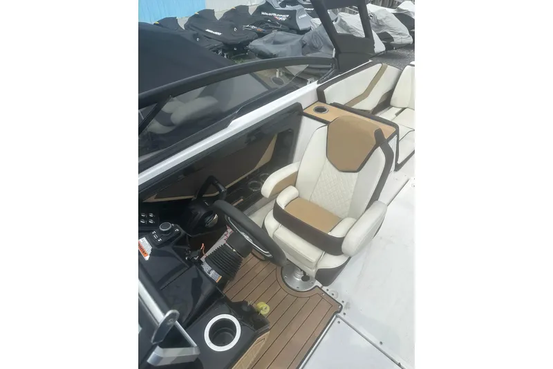 Slide: The Image of 2023 Yamaha Boats 252S cockpit with luxurious seating and modern controls. - 29