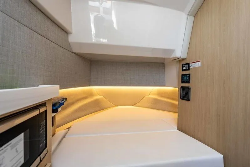 Slide: The Image of Interior cabin of 2026 Regal 38 Surf boat with modern amenities and lighting. - 15