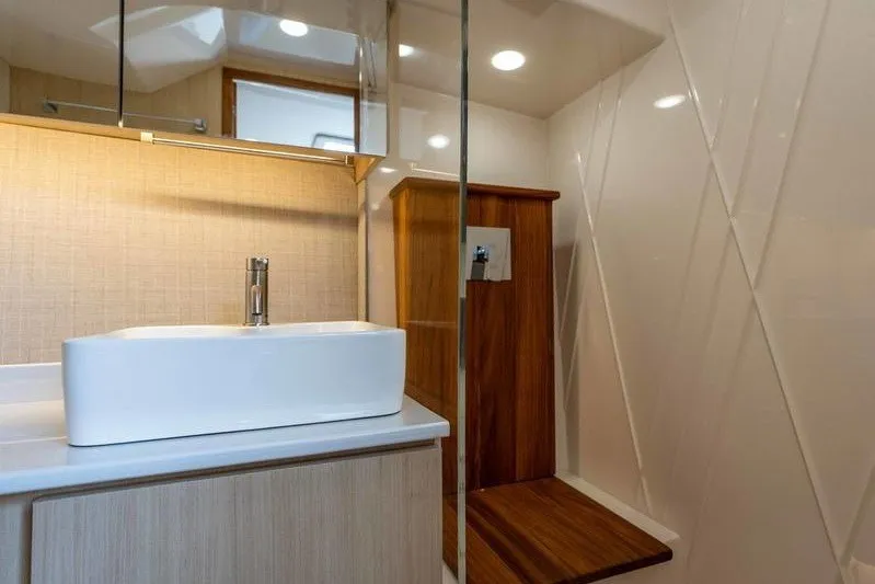 Slide: The Image of Modern bathroom interior of 2026 Regal 38 Surf yacht with sleek sink and wooden accents. - 14