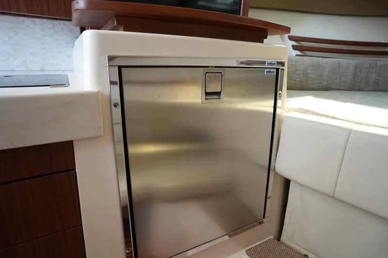 Slide: The Image of Stainless steel refrigerator in 2018 Grady-White Express 330 boat interior. - 37