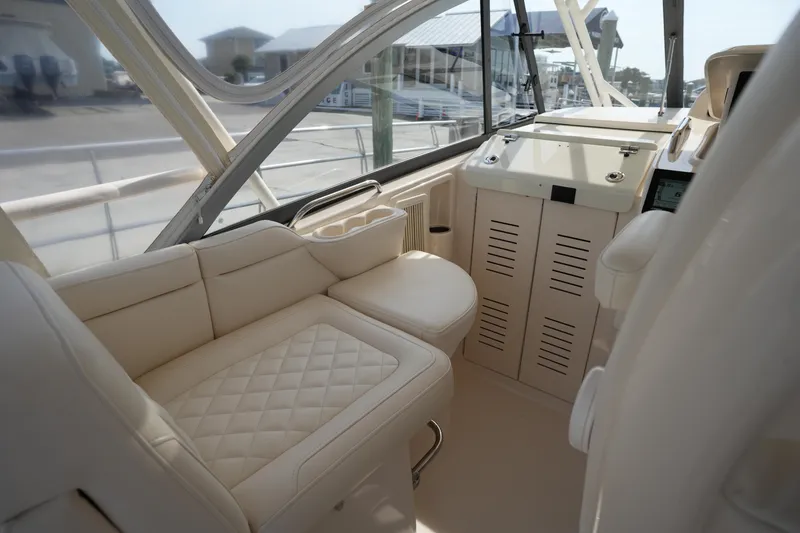 Slide: The Image of Luxurious interior of 2018 Grady-White Express 330 boat with plush seating. - 19