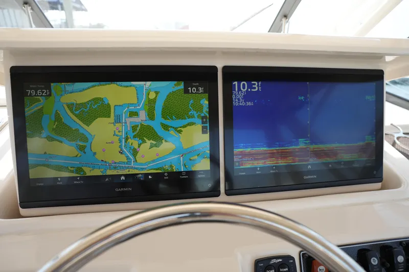 Slide: The Image of Garmin navigation displays on 2018 Grady-White Express 330 boat dashboard. - 23