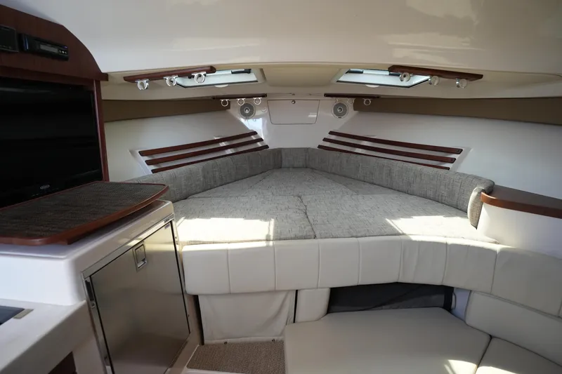 Slide: The Image of 2018 Grady-White Express 330 cabin interior with cozy seating and modern amenities. - 28