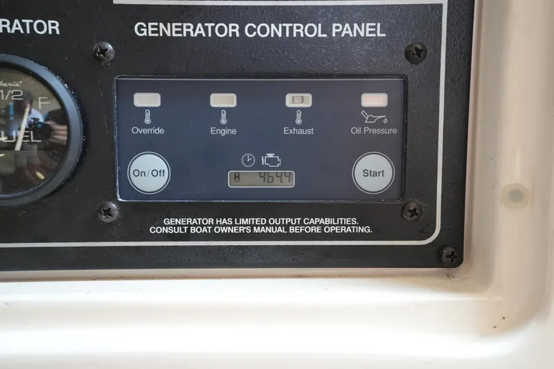 Slide: The Image of Generator control panel on 2018 Grady-White Express 330 boat, displaying 46.4 hours. - 32