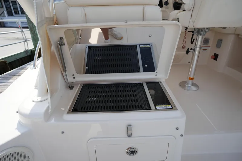 Slide: The Image of Outdoor grill station on 2018 Grady-White Express 330 boat deck. - 16