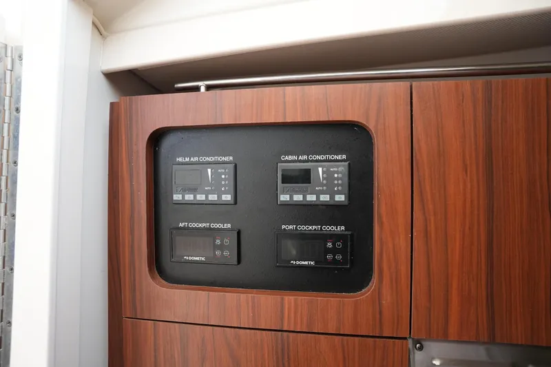 Slide: The Image of Control panel for air conditioning on 2018 Grady-White Express 330 boat. - 35