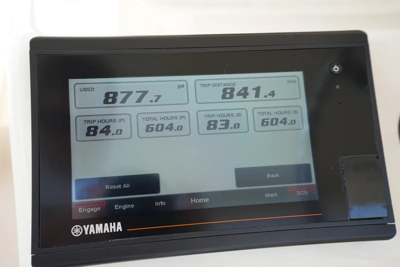 Slide: The Image of Yamaha display showing fuel usage and trip data for 2018 Grady-White Express 330. - 24