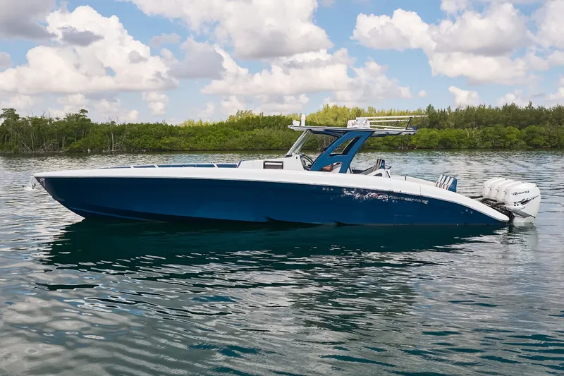 The Image of 2018 Midnight Express 43 Open boat on calm water under a cloudy sky. - 0