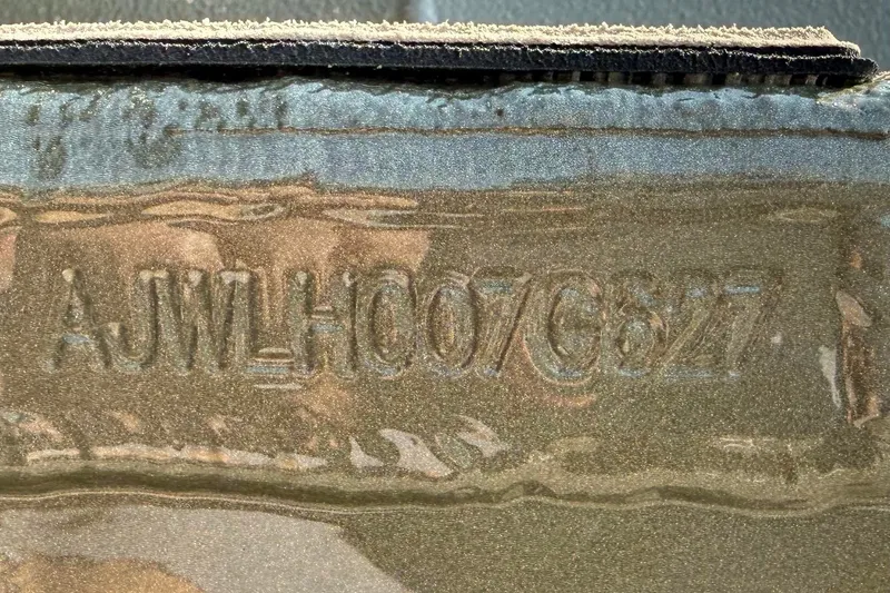 Slide: The Image of Close-up of embossed serial number on Thor Lake Hammer 1900CC, 2027 model. - 9