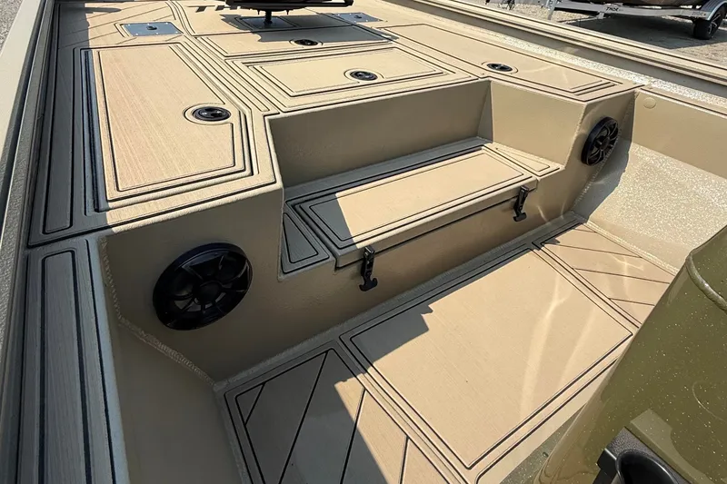 Slide: The Image of 2027 Thor Lake Hammer 1900CC boat interior with beige deck and built-in speakers. - 4