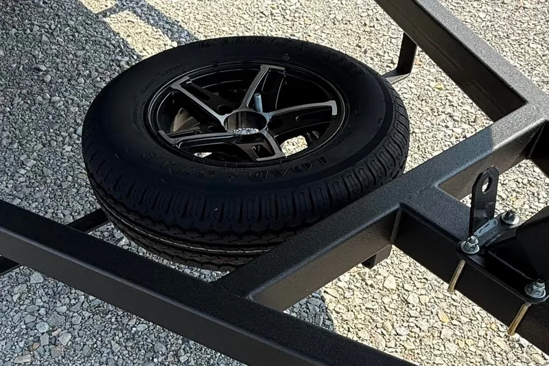 Slide: The Image of Spare tire mounted on a Thor Lake Hammer 1900CC trailer frame, 2027 model. - 8