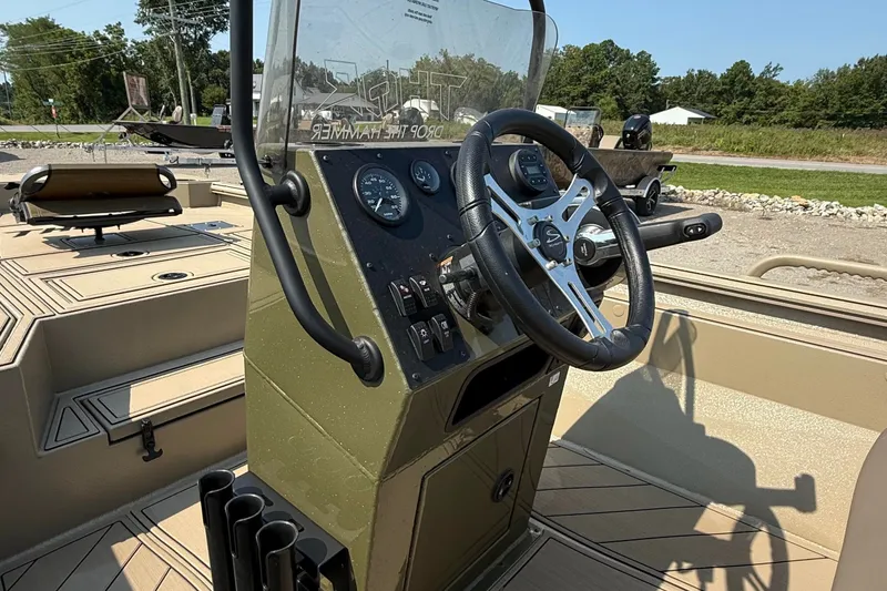 Slide: The Image of Steering console of 2027 Thor Lake Hammer 1900CC boat, featuring modern controls and gauges. - 3