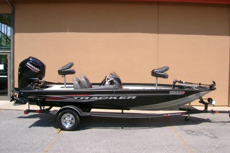 The Image of 2022 Tracker Pro Team 175 TXW fishing boat with Mercury engine on trailer. - 0