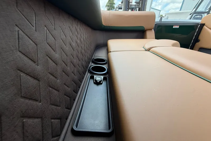 Slide: The Image of Luxurious seating and cup holders in 2027 Bennington 22 M Quad Bench boat interior. - 18
