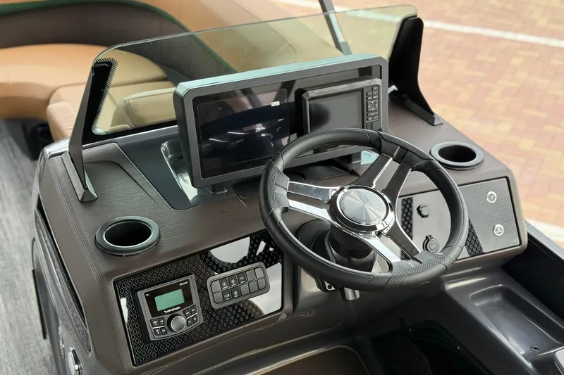 Slide: The Image of Steering console of 2027 Bennington 22 M Quad Bench boat with modern controls and display. - 14